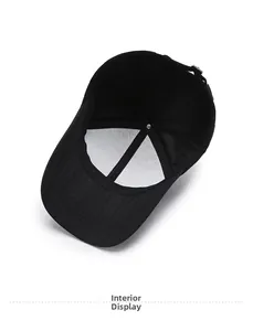 Interior view of black cotton baseball cap showing lining seams and metal buckle adjustment