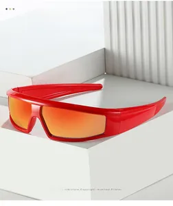 Detail of red sports sunglasses with orange mirrored lenses on a white geometric stand