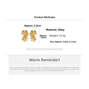Detail showing irregular metallic texture and dimensions of golden floral stud earrings