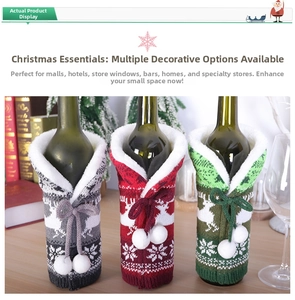Detail of Christmas knitted wine bottle covers with reindeer patterns and fur trim