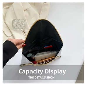 Internal view of silver evening clutch showing spacious compartments for phone and lipstick