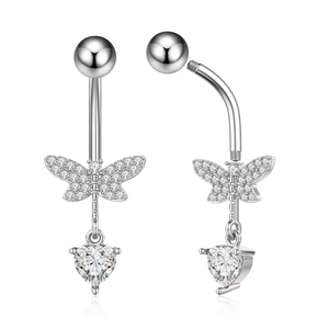 Detailed macro view of silver zircon butterfly navel ring with sparkling heart pendant