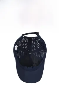 Detailed inner view of navy blue nylon baseball cap showing breathable laser-cut holes