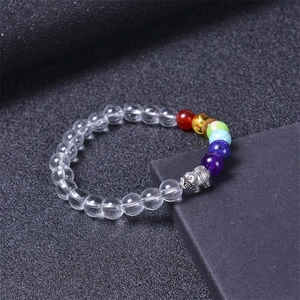 Chakra natural crystal stone beaded bracelet with silver elephant charm on black background