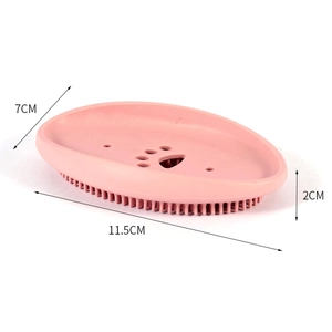 Pink silicone pet grooming brush with soft bristles and claw drainage design