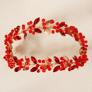 Detailed view of handmade double-layer headband with red crystals and gold leaves