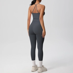 Detail showing cross-back strap design on high-waist yoga set in dark grey blue