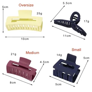 Matte shark hair clips in various sizes and colors from 5cm to 11cm on a white background