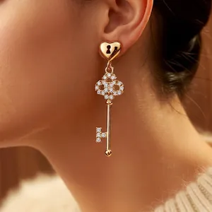 18k gold plated key drop earrings with heart motif and sparkling white zircon inlays