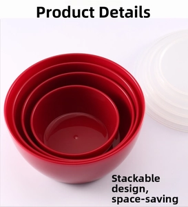 Detail of four nested red salad bowls with translucent lids showing compact storage design