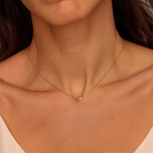 18K gold plated necklace with purple birthstone and zircon on model neck