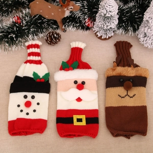 Three-piece knitted Christmas wine bottle covers featuring Santa, snowman and elk