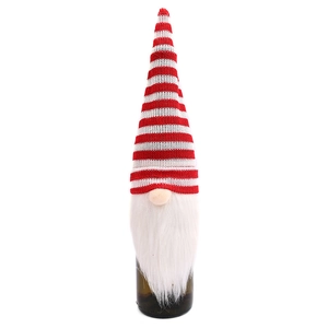 Christmas gnome wine bottle cover with red striped knit hat and long white beard on white background
