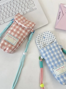 Padded quilted crossbody camera bags in pink and blue plaid with adjustable strap
