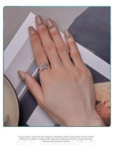 Close-up of a S925 sterling silver spider open ring worn on a finger for a trendy look