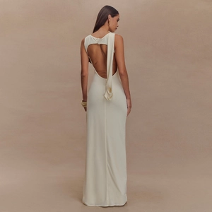 Elegant white backless maxi dress in silk-like satin with open back and side slit detail