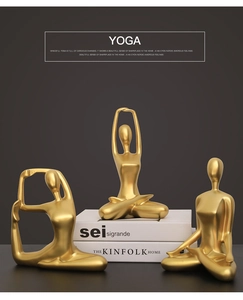 Three-piece golden yoga figurines set with different meditative poses on books