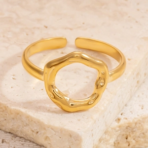 Minimalist gold stainless steel open ring with irregular hammered texture on a stone