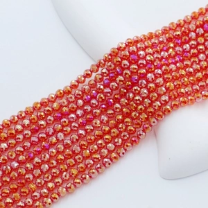 Close-up of 4mm faceted orange crystal glass beads with iridescent AB coating for DIY
