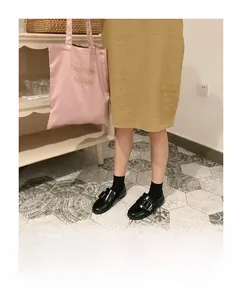 Pink satin tote bag with midnight circus gold embroidery and black square buckle loafers