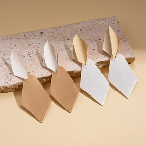 Minimalist irregular diamond earrings with brushed texture in gold and silver