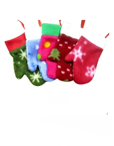 Detail view of colorful felt Christmas glove cutlery holders with snowflake patterns