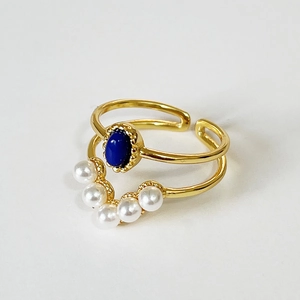 S925 silver stacked rings set with blue oval stone and white pearls in gold finish