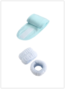 Close-up of light blue coral fleece headband with Velcro and matching absorbent wristbands
