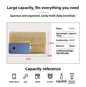 Detail view of woven straw clutch with metal clasp and size comparison to a phone