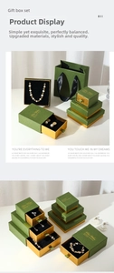 Macro shot of luxury vintage green jewelry gift boxes with matte gold lining and drawer design