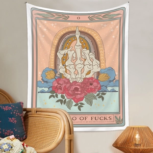 Detailed close-up of tarot style tapestry with skull hand and rose design on a wall