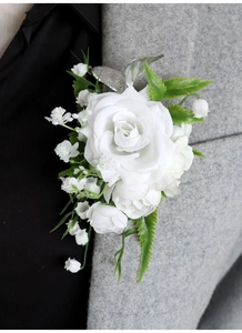 Detail of elegant white artificial rose boutonniere pinned on a gray suit lapel