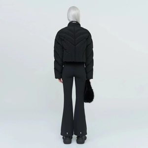Rear view of black velvet flared pants and puffer jacket set for winter sports