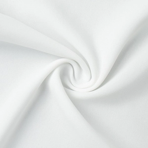 Macro shot of white semi-sheer chiffon fabric showing delicate grainy texture and soft drape