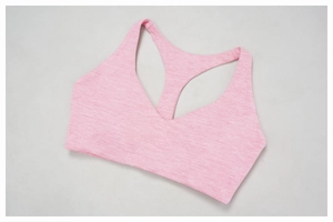Detail of pink space-dye racerback sports bra with V-neckline and brushed knit fabric