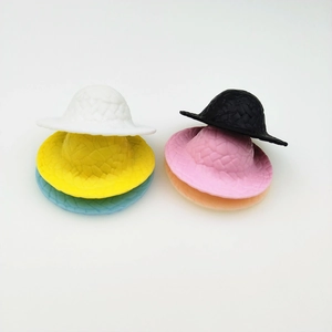 Detailed view of mini colorful plastic straw-textured hats in six different colors