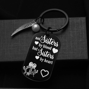Black stainless steel sisters keychain with feather and pearl charm in a gift box