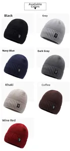 Detail view of seven color options for this thick knitted winter beanie with logo patch