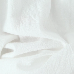Close-up of pure white cotton fabric texture on a sweet style lace mini dress