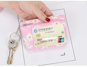 Pink daisy floral coin purse detail with transparent card slot and metal key ring