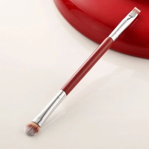 Professional dual-ended makeup brush with red glitter handle and silver ferrules
