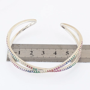 Detailed view of rainbow zircon crossover bracelet with ruler showing 5.5cm diameter