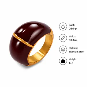 Detailed view of British vintage gold plated titanium ring with dark red drip oil glaze