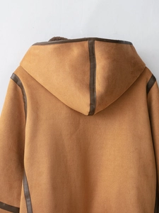 Detail view of brown suede hooded coat with premium leather piping and soft texture