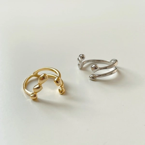 Detailed macro view of dual-layer irregular gold and silver S925 sterling silver rings