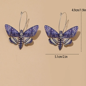Detailed size view of skull moth acrylic earrings measuring 4.9cm by 5.1cm