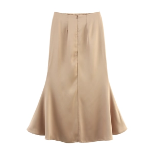 Detail of elegant champagne satin mermaid maxi skirt with smooth glossy texture and high waist