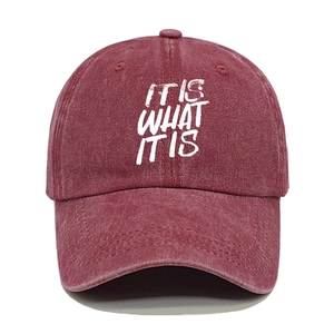 Washed burgundy cotton baseball cap featuring the white IT IS WHAT IT IS printed slogan