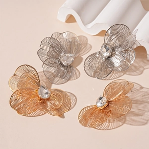 Dramatic metallic flower petal earrings with sparkling crystals in gold and silver finish