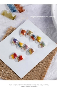 Detailed display of 11-color marble ink nail art stickers with metallic gold foil texture